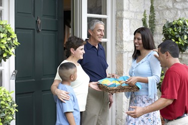 The Carmine's brought cookies to their new neighbors to welcome them to the neighborhood.