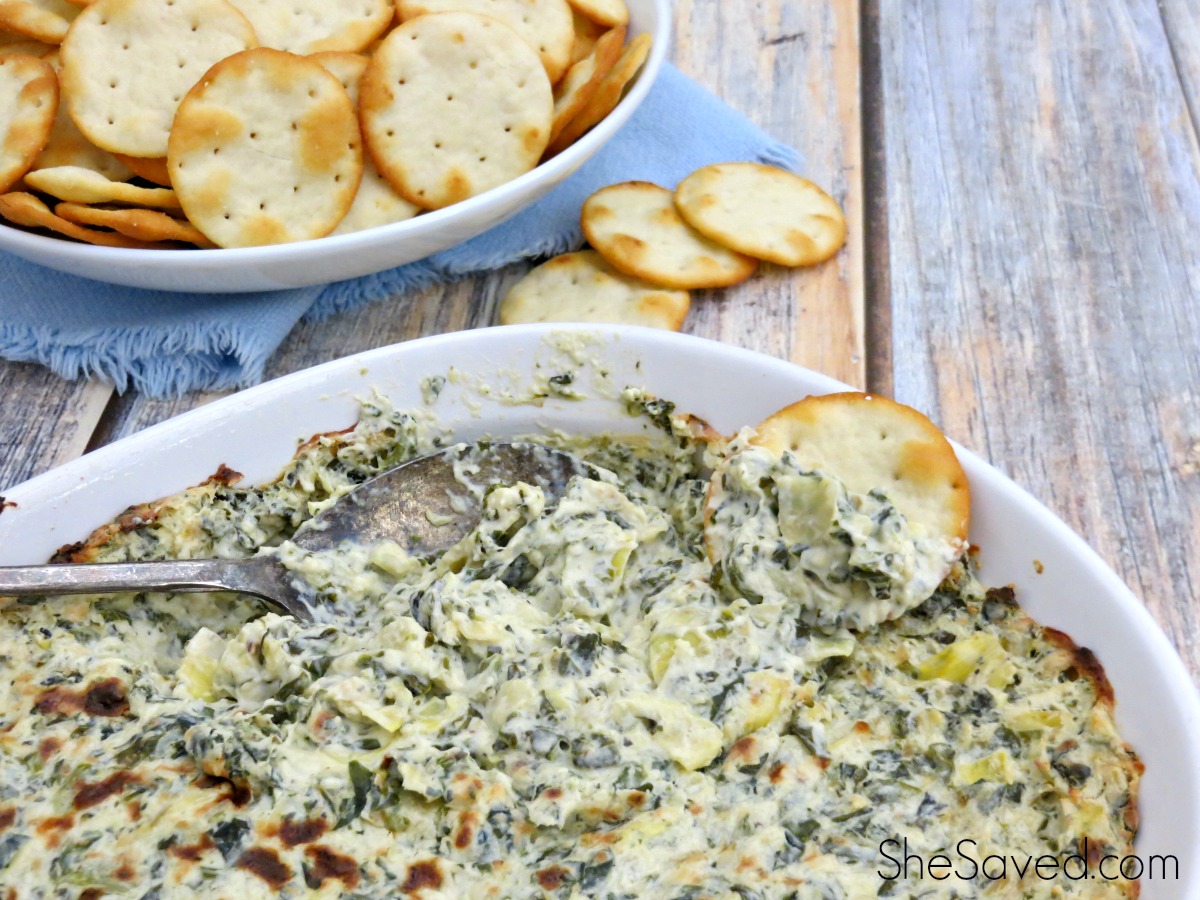 I love this easy appetizer recipe for game day or when you're having company. Get the scoop (get it?) on my Hot Spinach and Artichoke Dip Recipe! Yum!