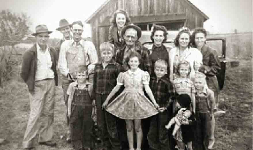 Large Family Posing in Front of Barn - Black and White Photo