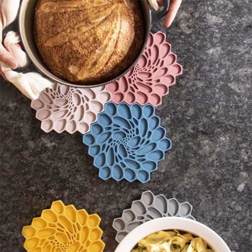 Nervous System Hive Trivets are back! A modular silicone rubber trivet featuring an organic embossed pattern inspired by cellular forms. Extra fun tiled together!